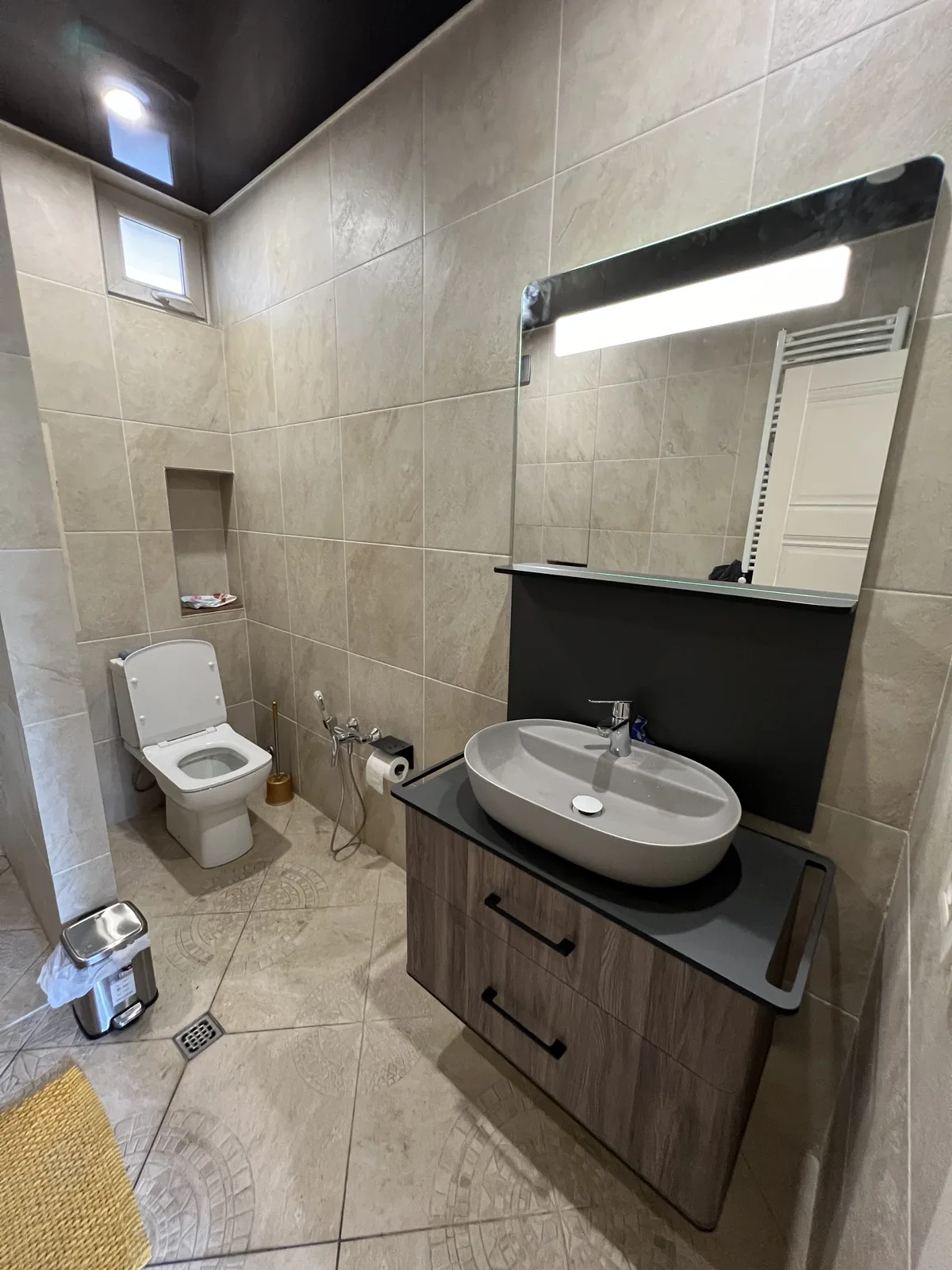 Modern bathroom with vessel sink and large mirror